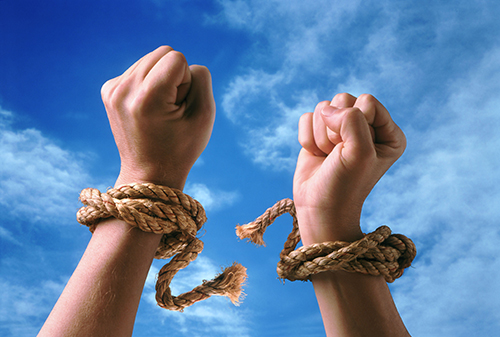 hands with wrists breaking ropes that bound them - symbolizing the freedom on learning how to DIY